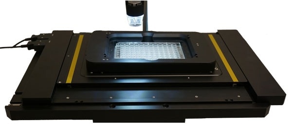 A piezo-Z-stage insert with well plate on a long travel XY microscope stage based on ultrasonic piezo linear motors. Compact design, a wide dynamic range from less than 1 µm/sec to 100 mm/sec, and rapid response are benefits of the stiff piezo motor design. High positional stability is achieved due to the self-clamping nature of these direct-drive motors.