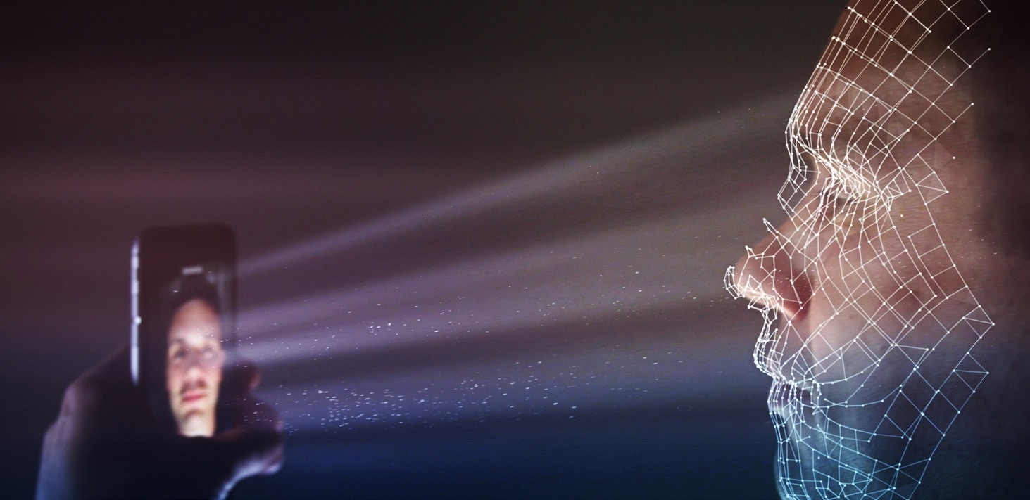 Visual representation of an NIR system being used for facial recognition. The device emits a DOE dot pattern (invisible to the user) that is cast on the face and can shine into the eyes.