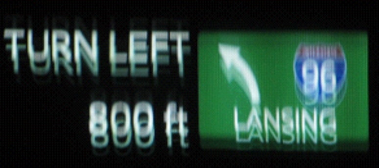 Ghosting of the image is caused by misalignment of HUD projections that are reflected back from the windshield.