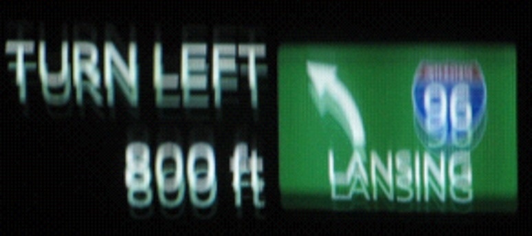 Ghosting of the image is caused by misalignment of HUD projections that are reflected back from the windshield.