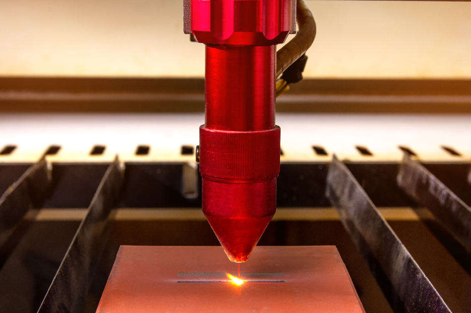 Closeup Laser engraver working and engraving flat ceramic stone