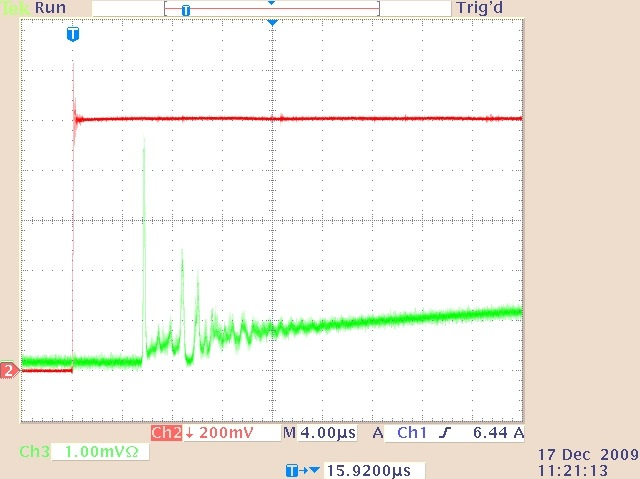 The quasi-cw laser output (lower trace) and drive current waveform (upper trace) showing the relaxation oscillations at the beginning of the pulse shown in Figure 4.