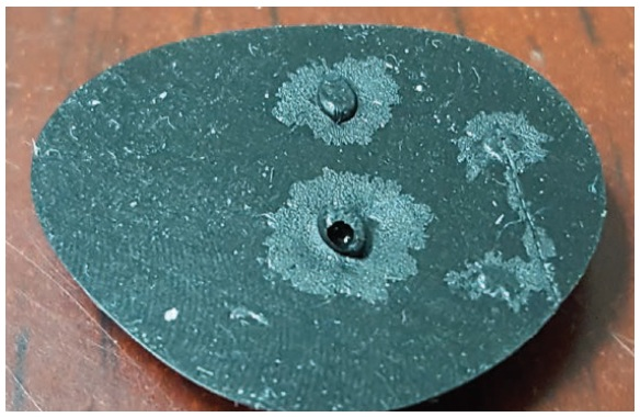 0026” (66µm) pit in aluminum surface.