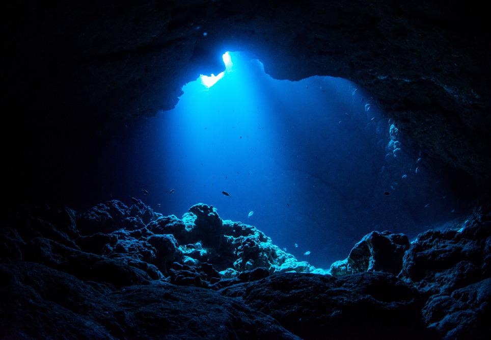 ray of light shining on underwater cave