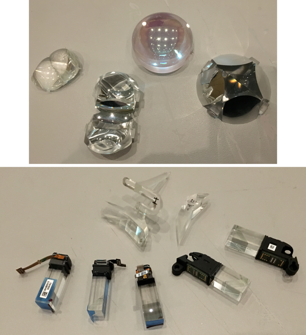 Various optical components from XR devices used to shape, bend, and transmit light to create images.