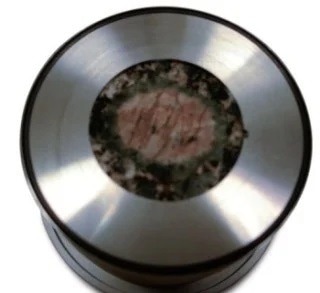 Heterogeneous feldspar sample seen in the 30 mm aperture sample holder.