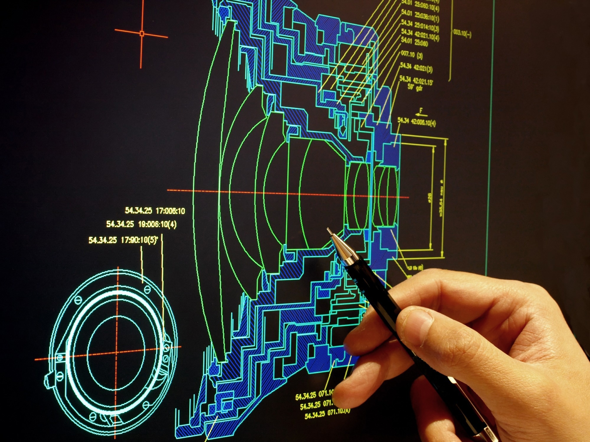 engineer working on computer at optical prototype design