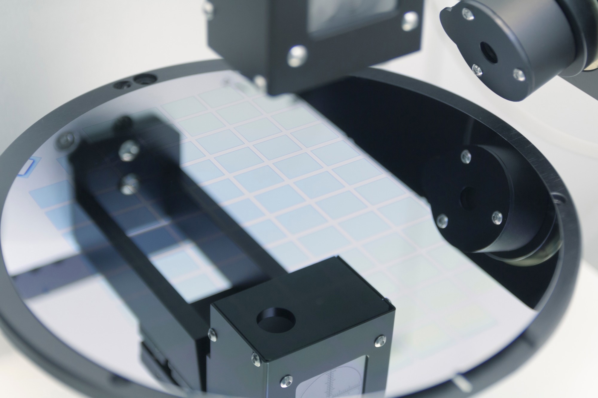 Ellipsometer tool in a laboratory. Silicon wafer of purple color measure thickness of film on ellipsometer