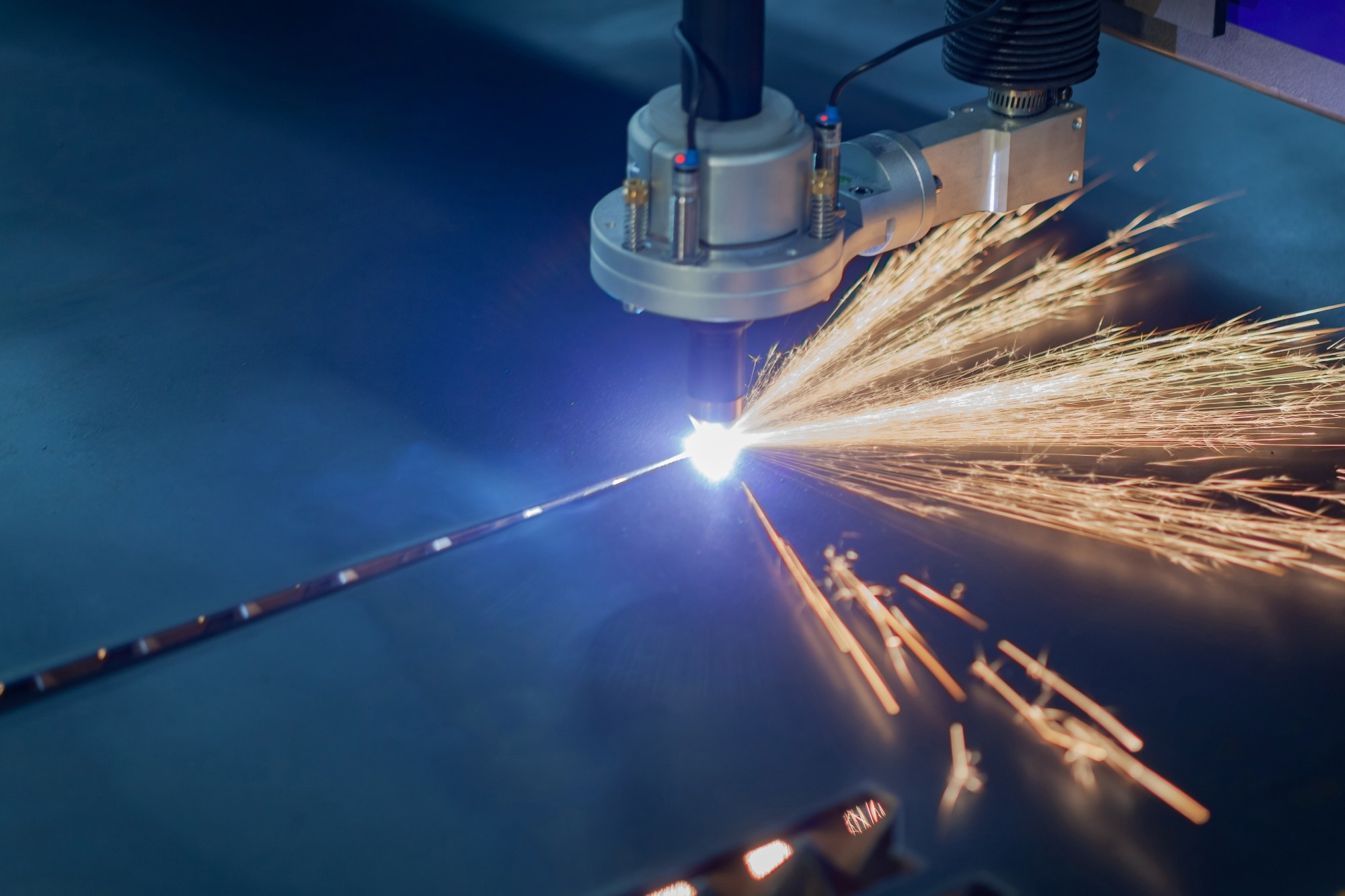 plasma cutting machine cuts metal sparks fly