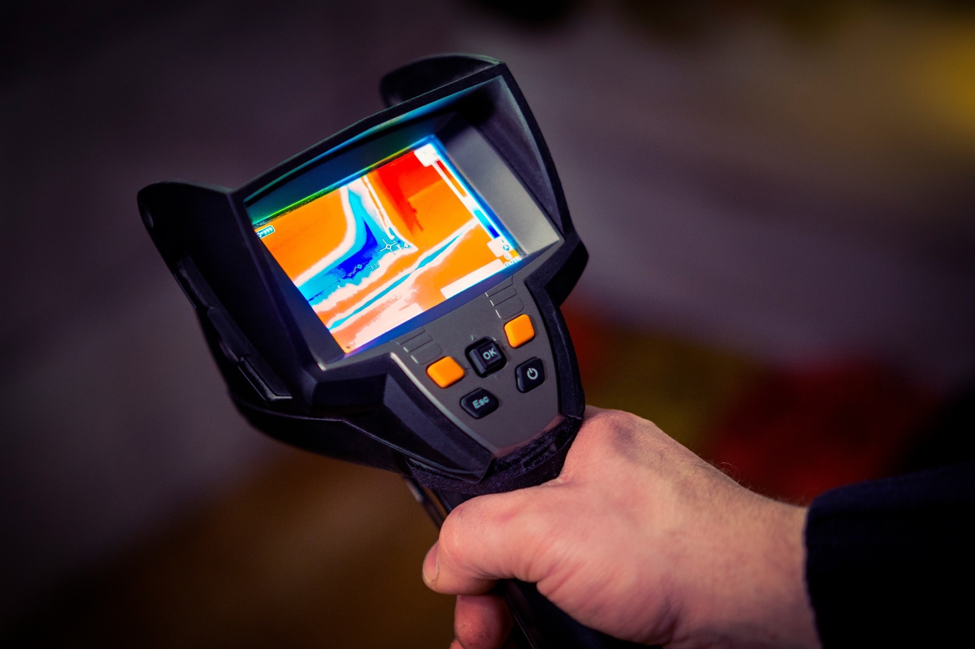 Professional thermal imaging camera in a man