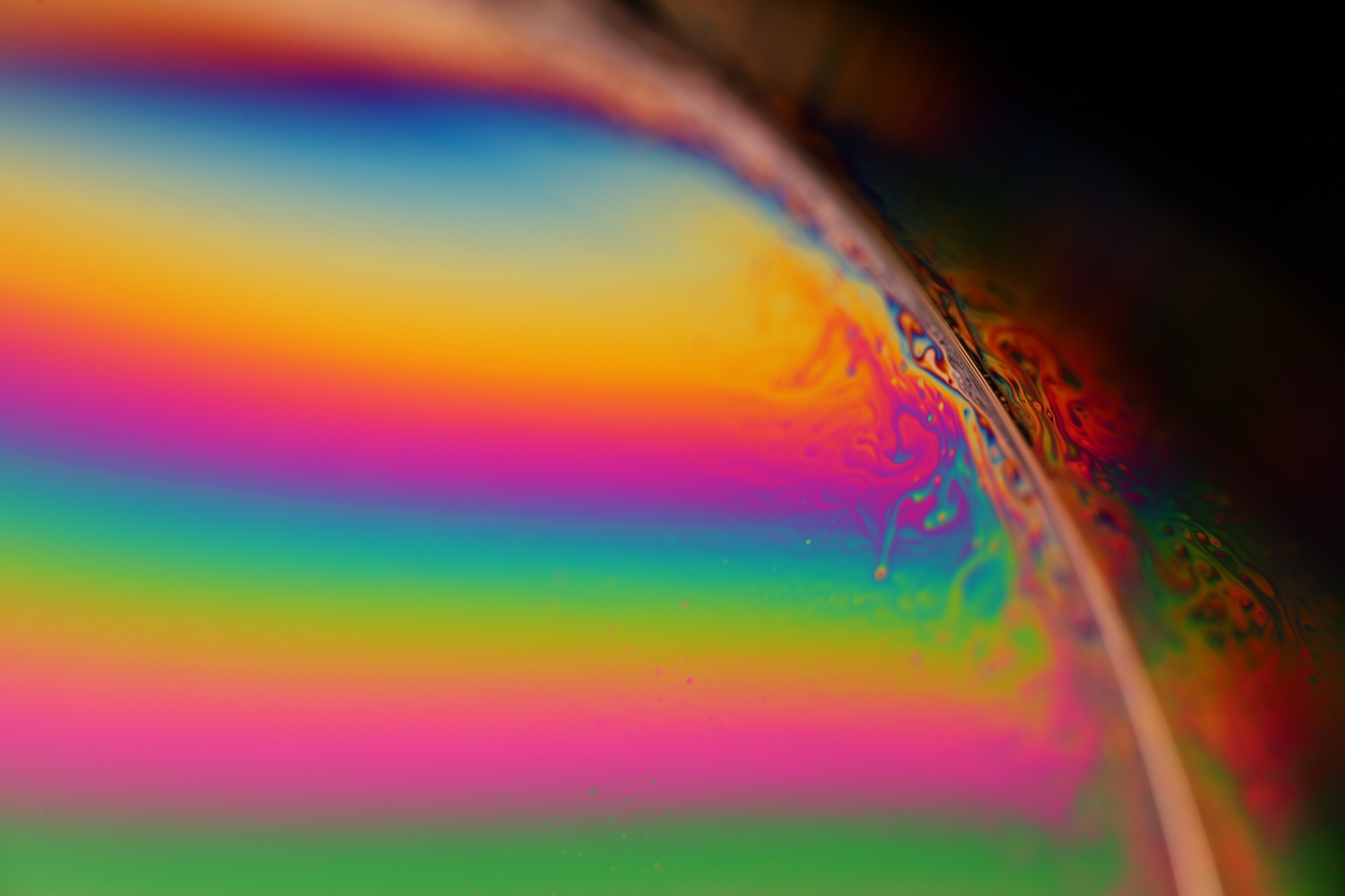 A rainbow reflection in a liquid
