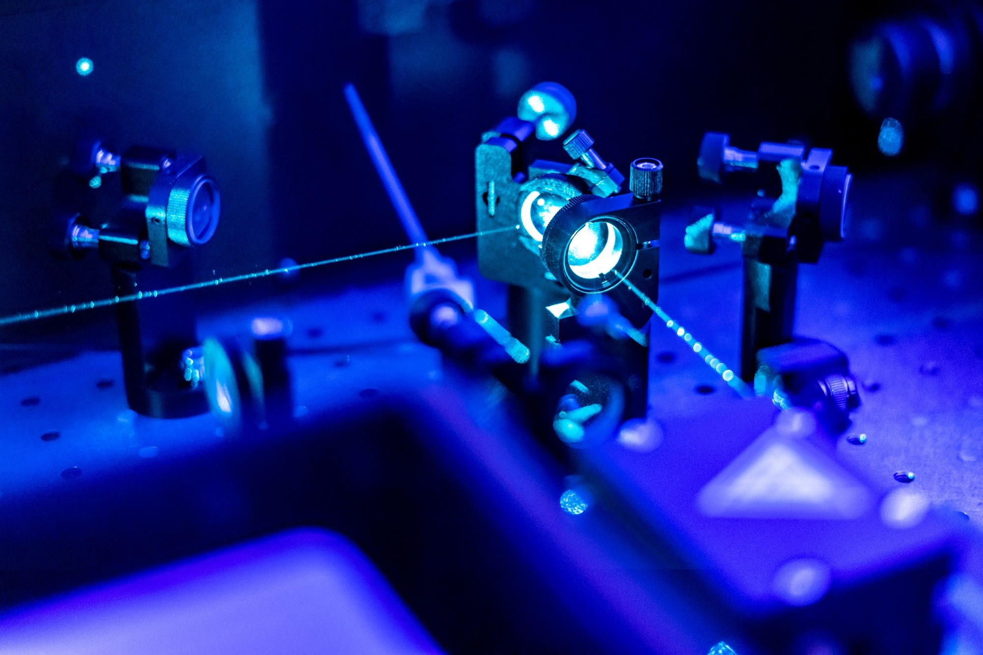 A laser refelcting on an optic table