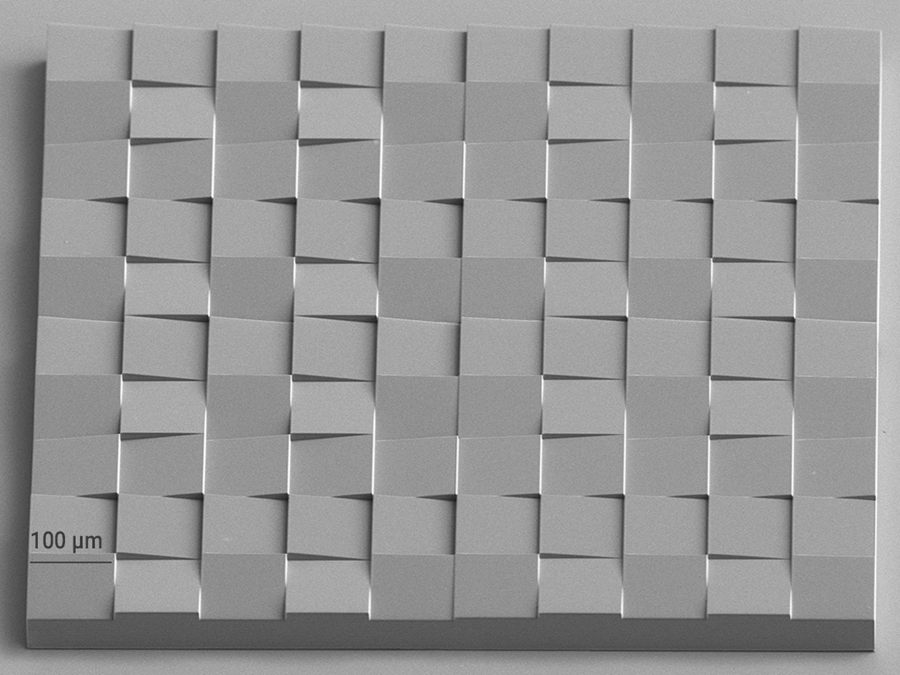 The microprism array of this 2GL-fabricated master template features inclined plane surfaces with a surface roughness of Ra ≤ 5 nm and ultra precise sharp edges