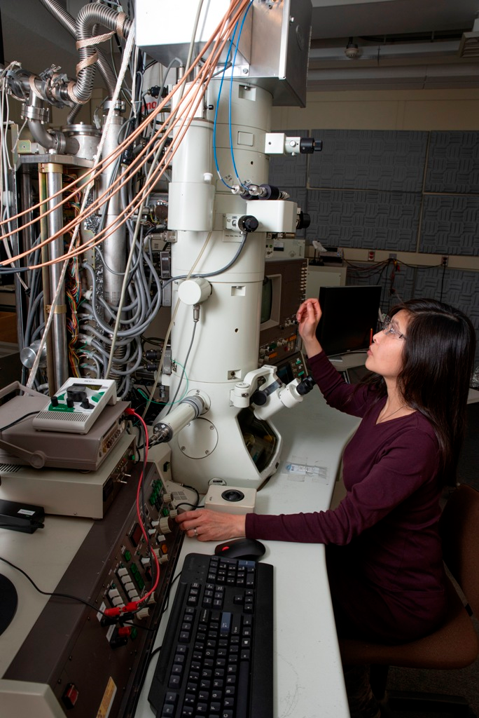 NIST researcher June Lau with a transmission electron microscope (TEM) that she and her colleagues retrofitted in order to make high-quality atom-scale movies