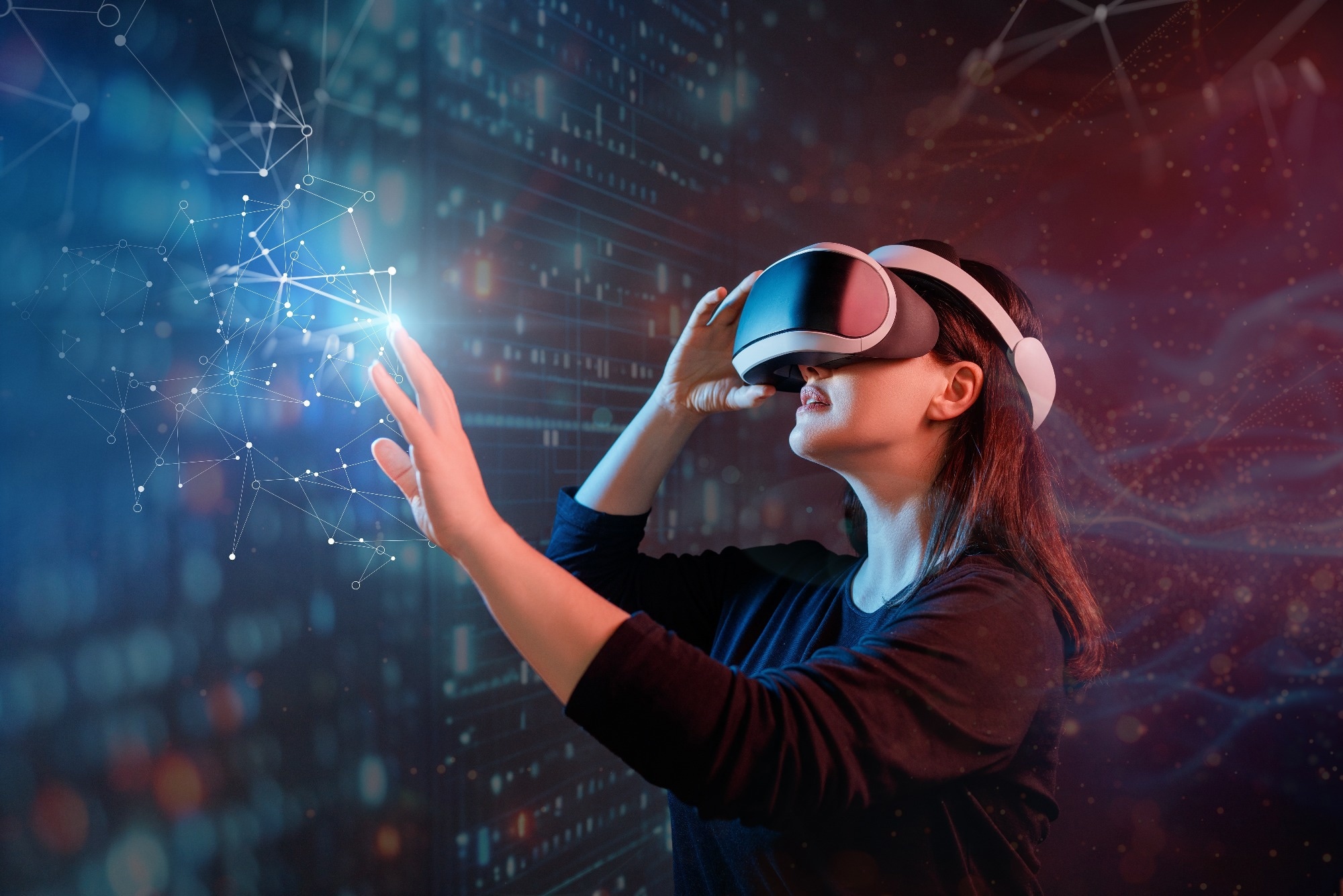 Study: Individually addressable nanoscale OLEDs. Image credit: Yuganov Konstantin/Shutterstock.com Woman wearing virtual reality goggles, reaching out as if touching the virtual image.