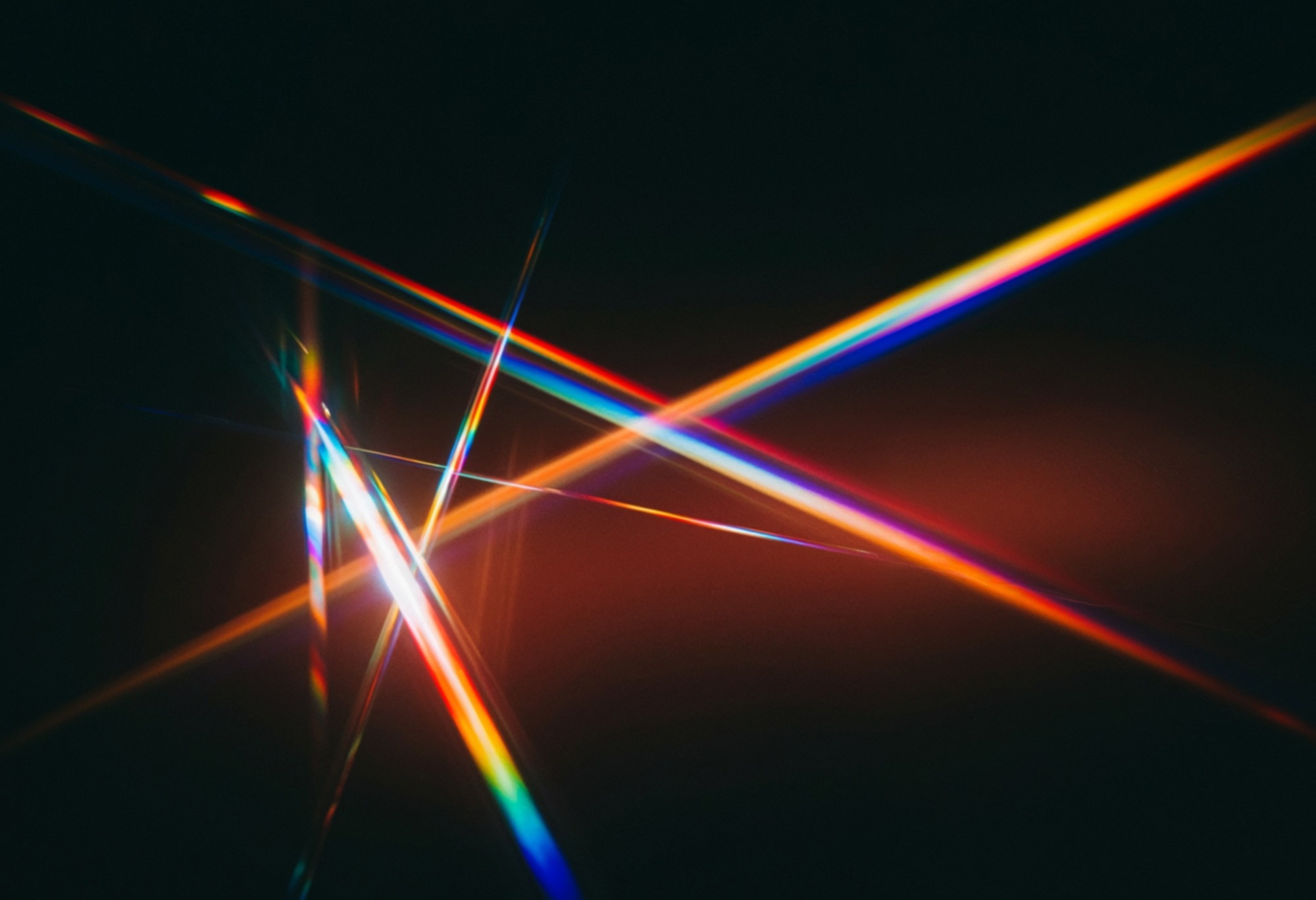 Colored light beams intersecting in a prism