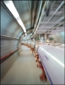 Racing a Charged Particle at Light Speed