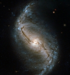 Hubble Captures Close-Up View of NGC 986 Barred Spiral Galaxy