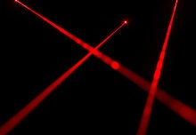 Optical Tweezers Can Move, Melt, and Scatter Enigmatic Lipid Rafts