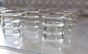 Macroscopic Crystals Use Internal Rotation to Attenuate Wave Propagation