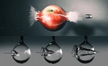 High-Speed Camera Captures a Water Jet’s Splashy Impact as it Pierces a Droplet