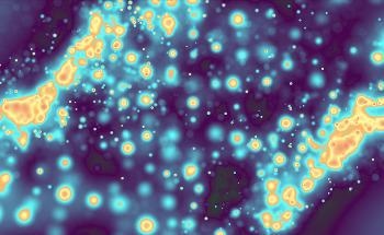 Optical Tweezers Reveal Intracellular Softening and Fluidity During Cell Division